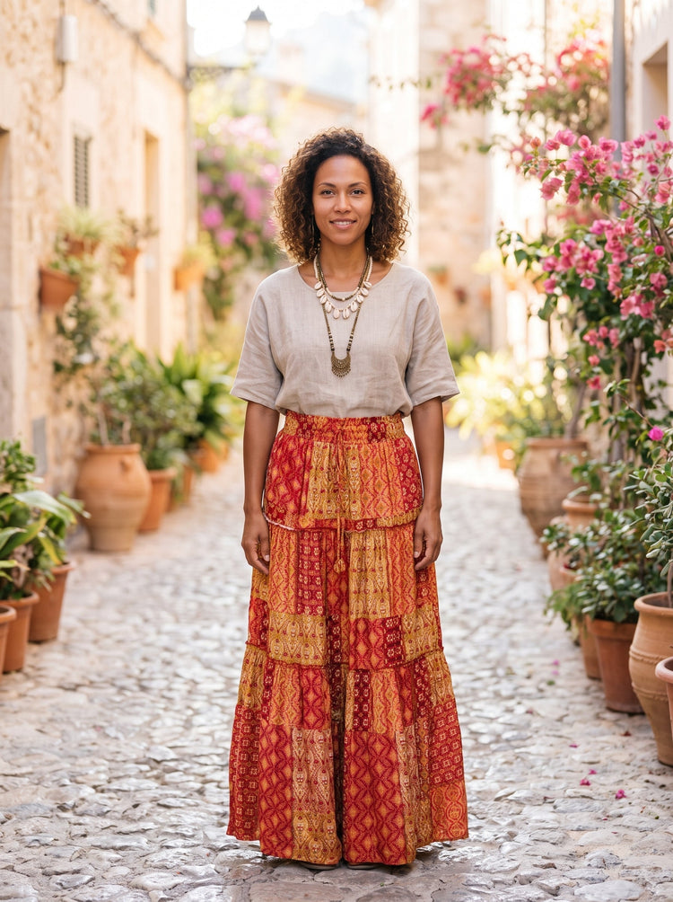 Woman wearing a patchwork maxi skirt and a relaxed top in hippie style