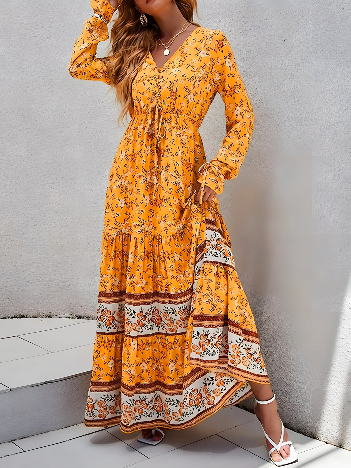 Saffron yellow maxi dress with long sleeves and woven border