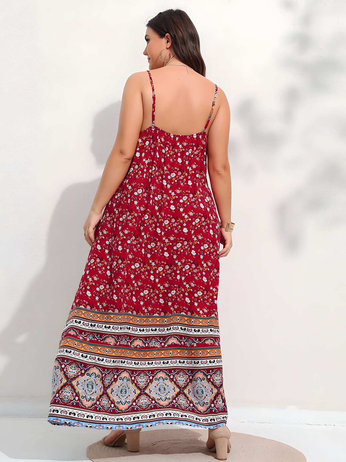 Back view of red floral boho maxi dress worn
