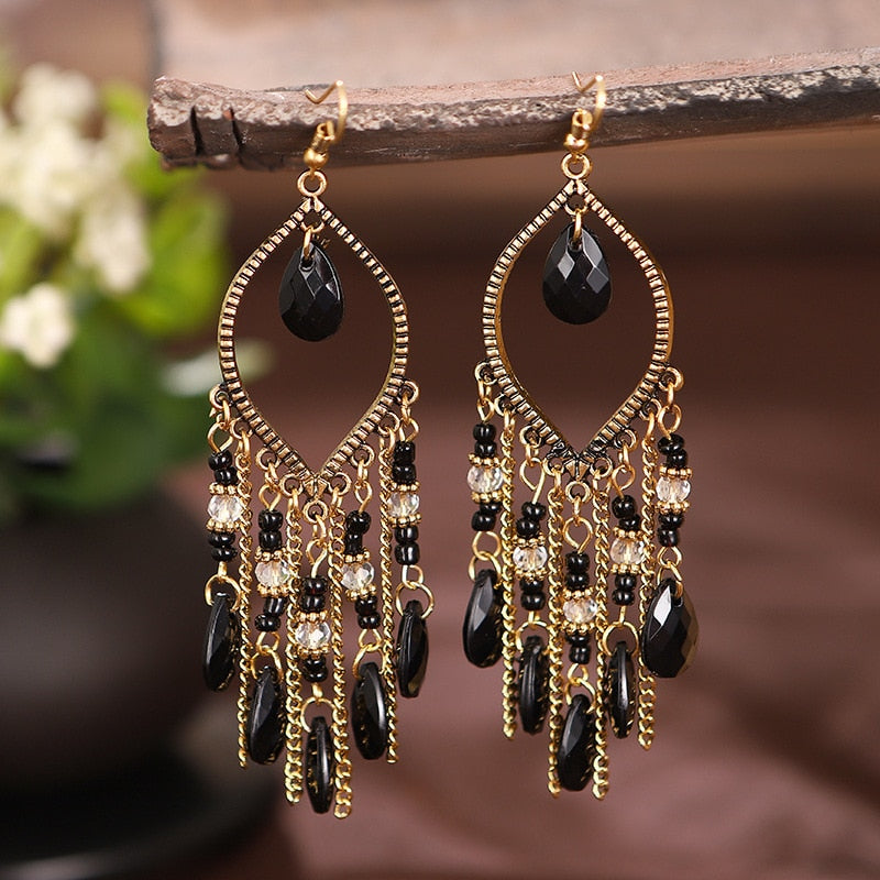 Flower-shaped boho hippie earrings in a gold tone