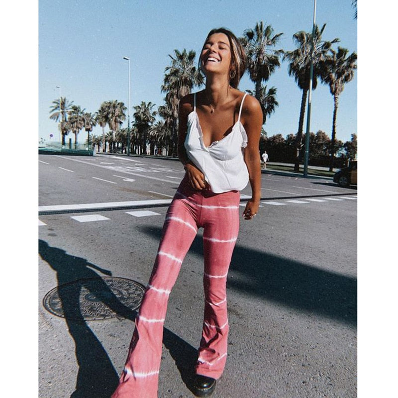 Striped bell bottom hippie pants in soft pink and white
