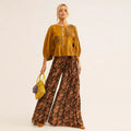 Pantalón palazzo boho con estampado floral fluido