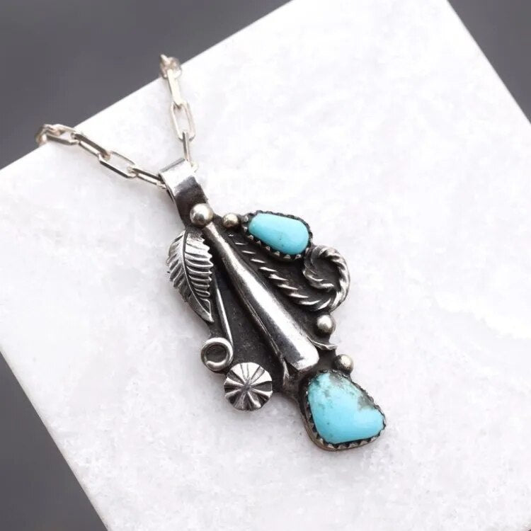 Crescent moon pendant necklace set with turquoise stones