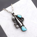 Crescent moon pendant necklace set with turquoise stones