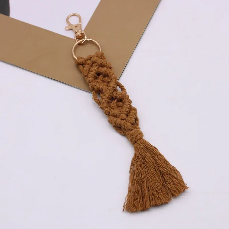 Macrame feather charm hanging from a metal key ring