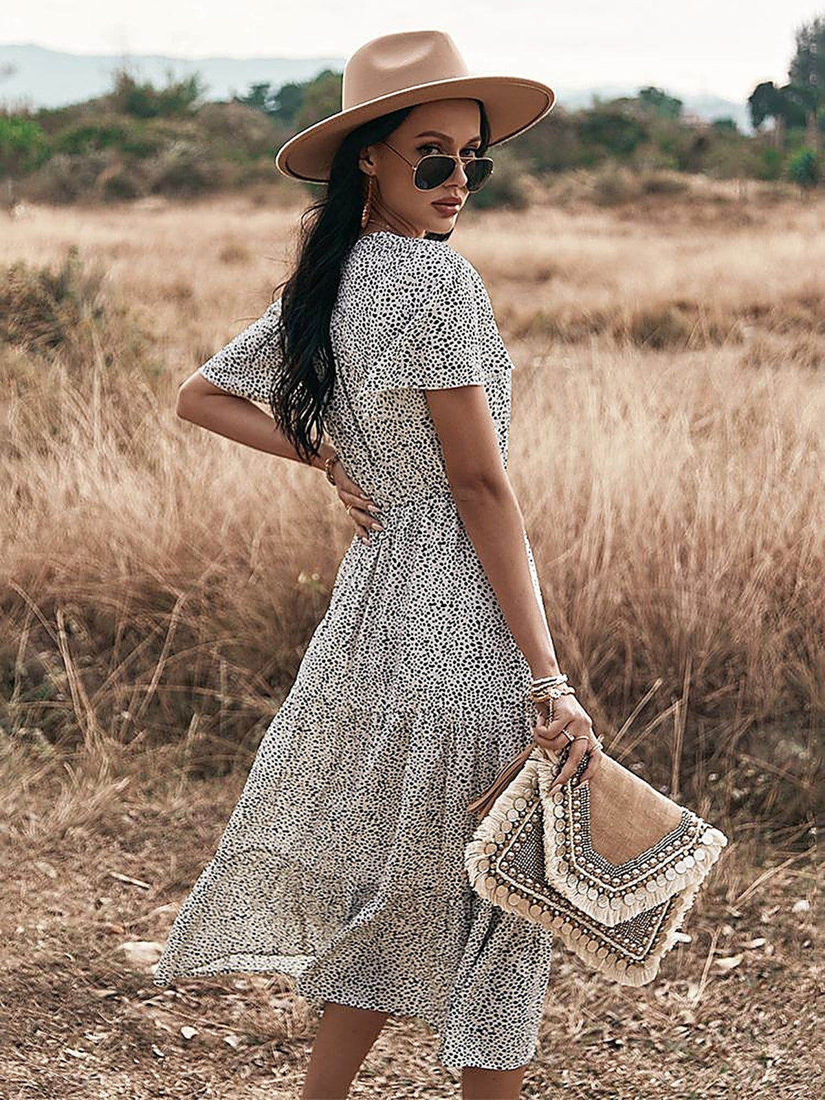 Back view of the midi dress and its flowing drape