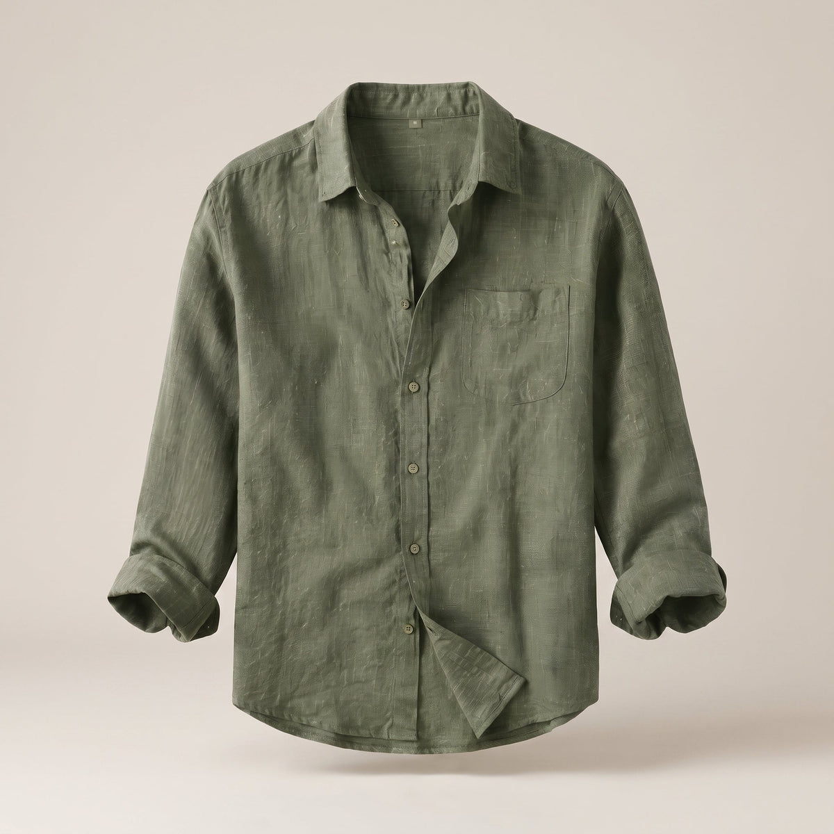 Khaki linen shirt on an invisible mannequin, oversized cut, studio background