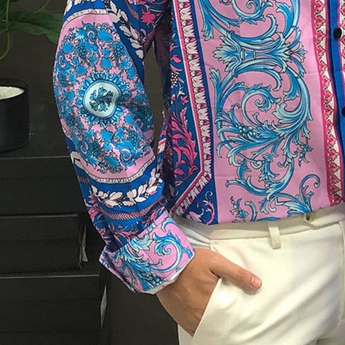 Close-up of the baroque pattern on the satin sleeve