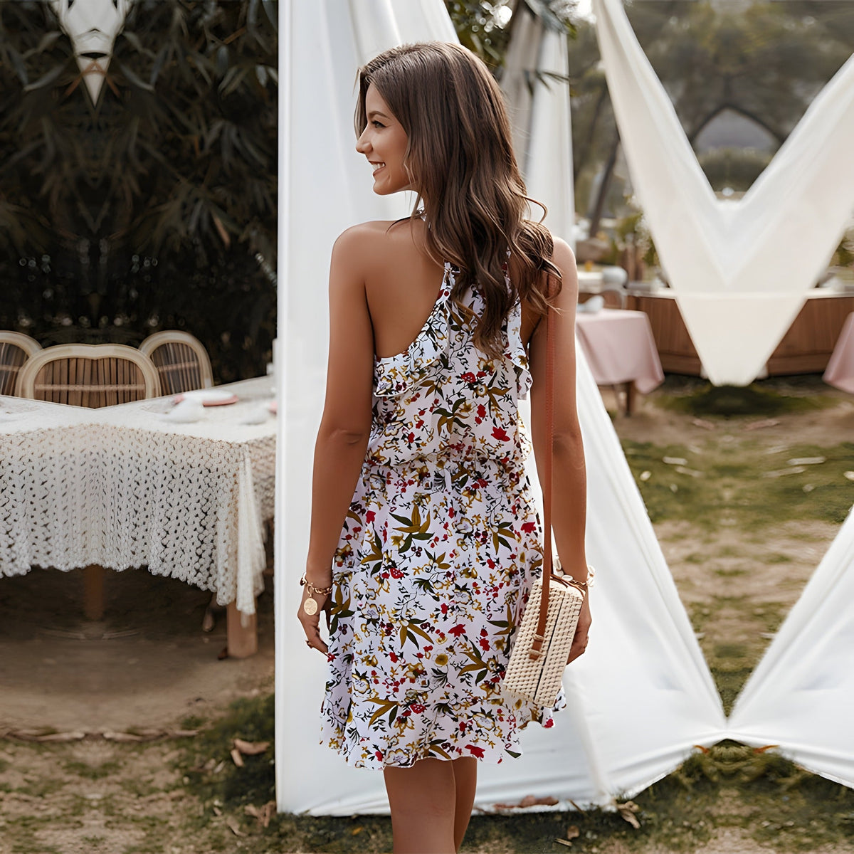 Back view of the white floral ruffle dress with open back