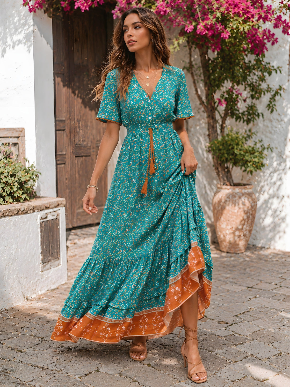 Full length view of the turquoise floral dress in a Mediterranean alley