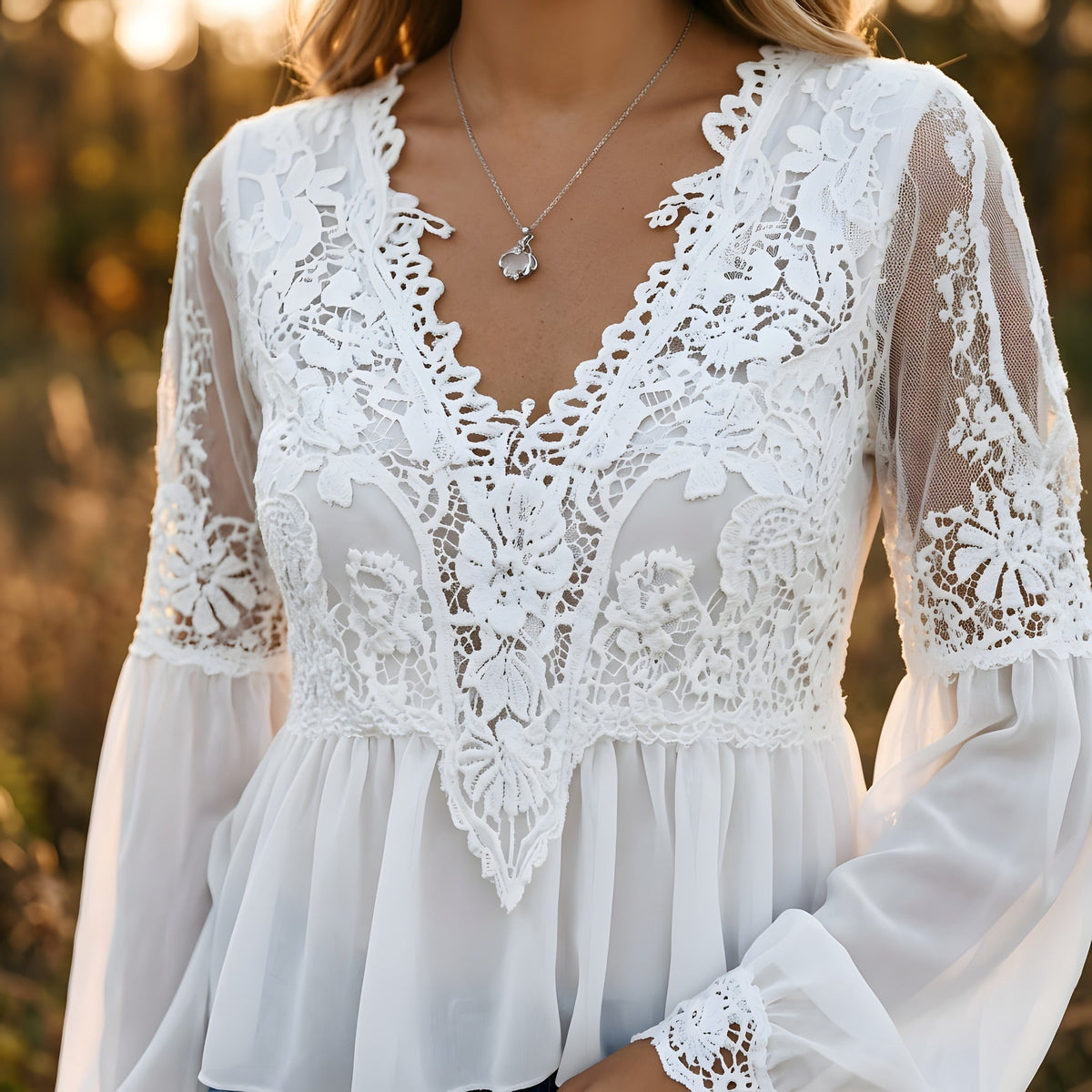 Detail of the floral guipure lace panel and deep V-neck