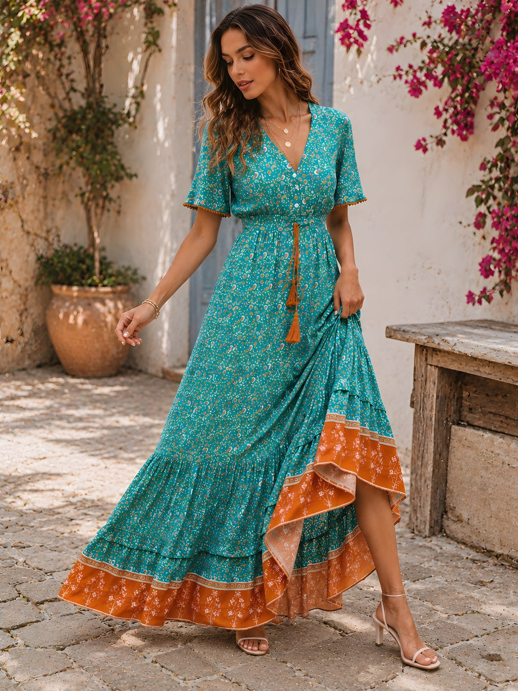 Model walking in the turquoise floral dress, ruffled sleeves and tasseled tie