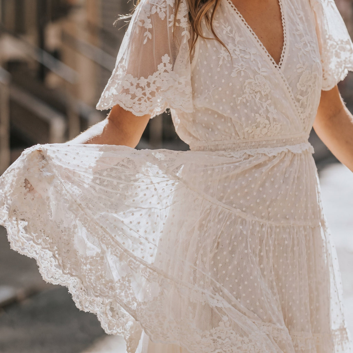 Close-up of the embroidered lace and dotted Swiss fabric