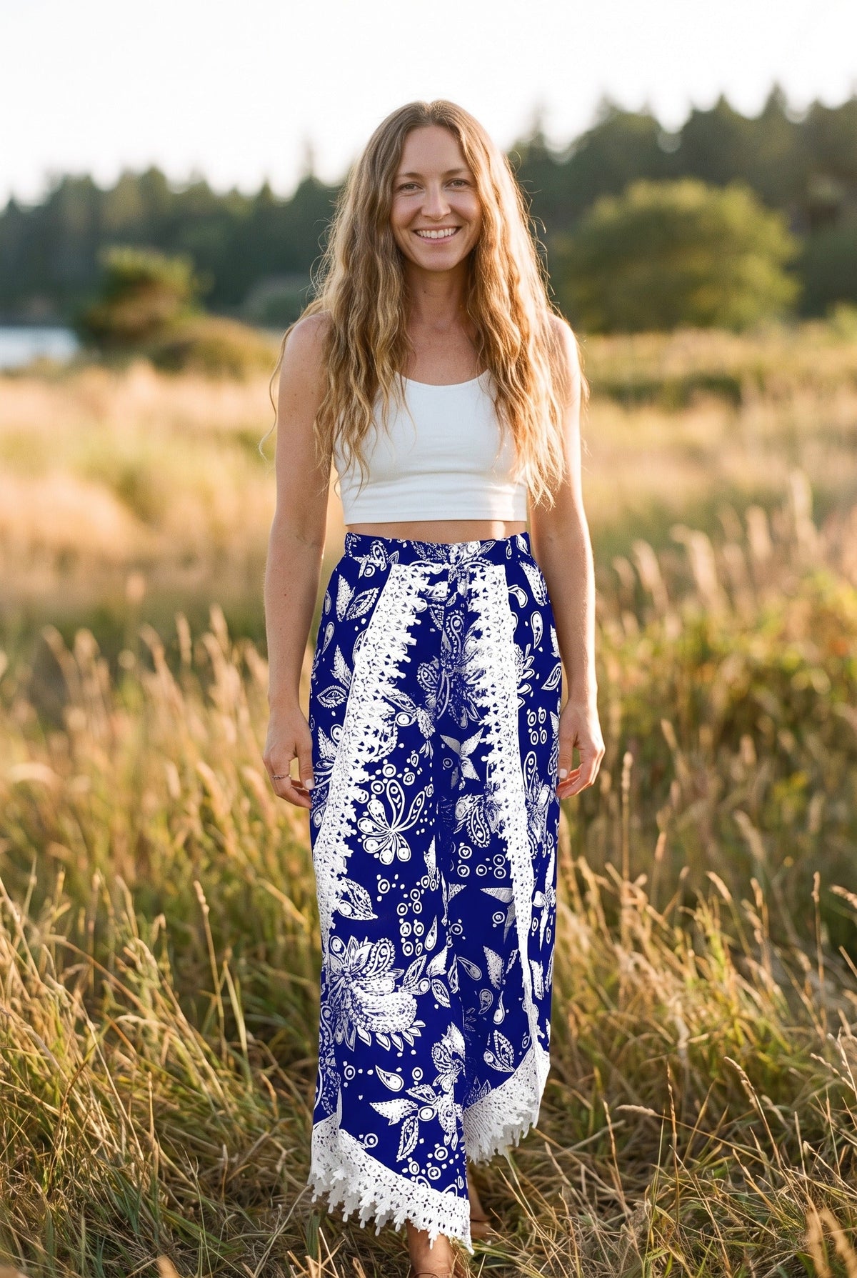 Smiling model wearing wide leg boho pants with floral print