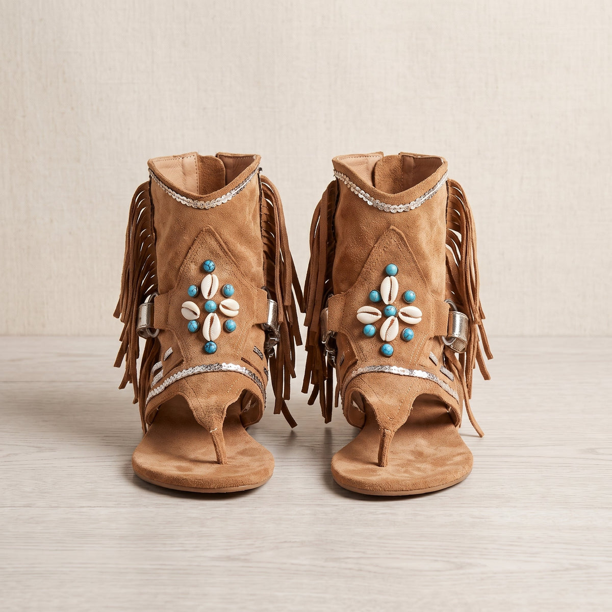 Suede fringed hippie boot-sandals shown against a plain background