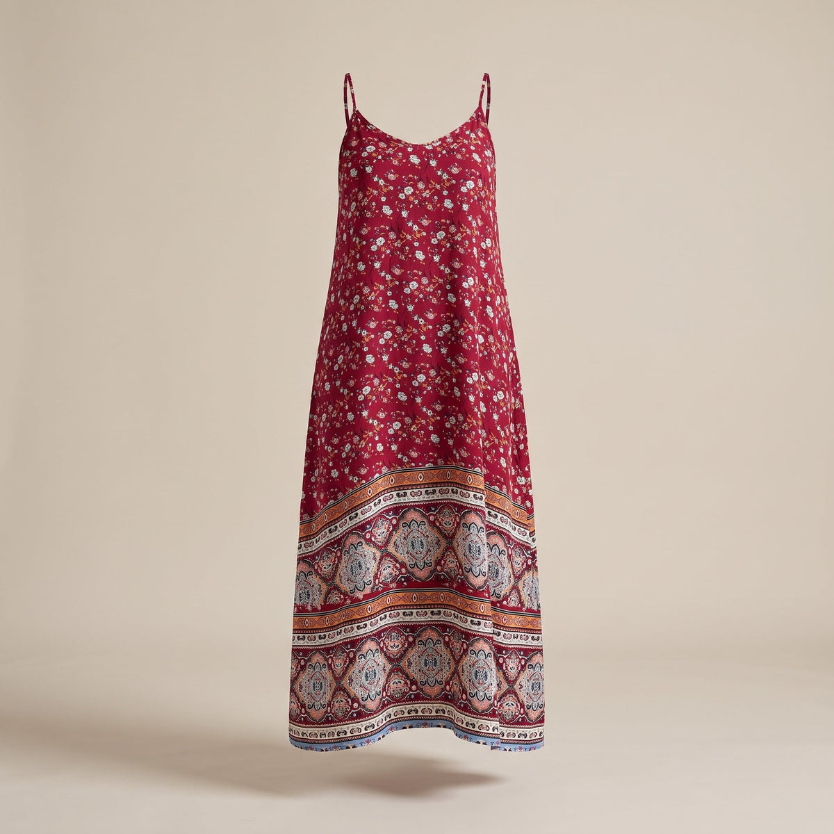 Red floral boho maxi dress on invisible mannequin, studio view
