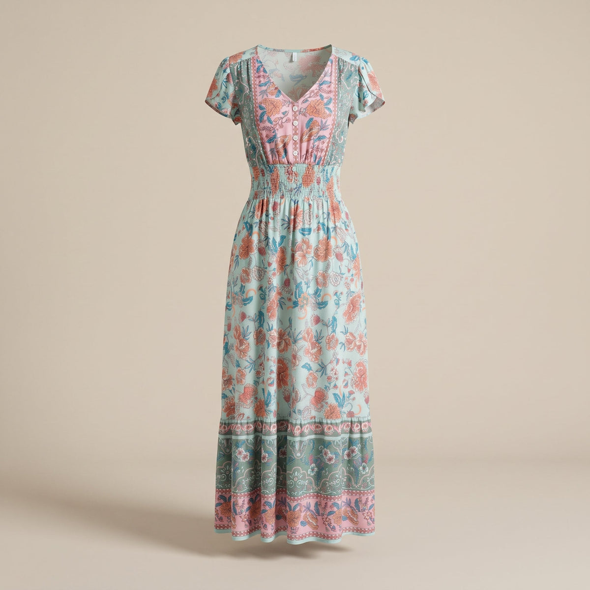 Floral boho maxi dress shown on a ghost mannequin in studio