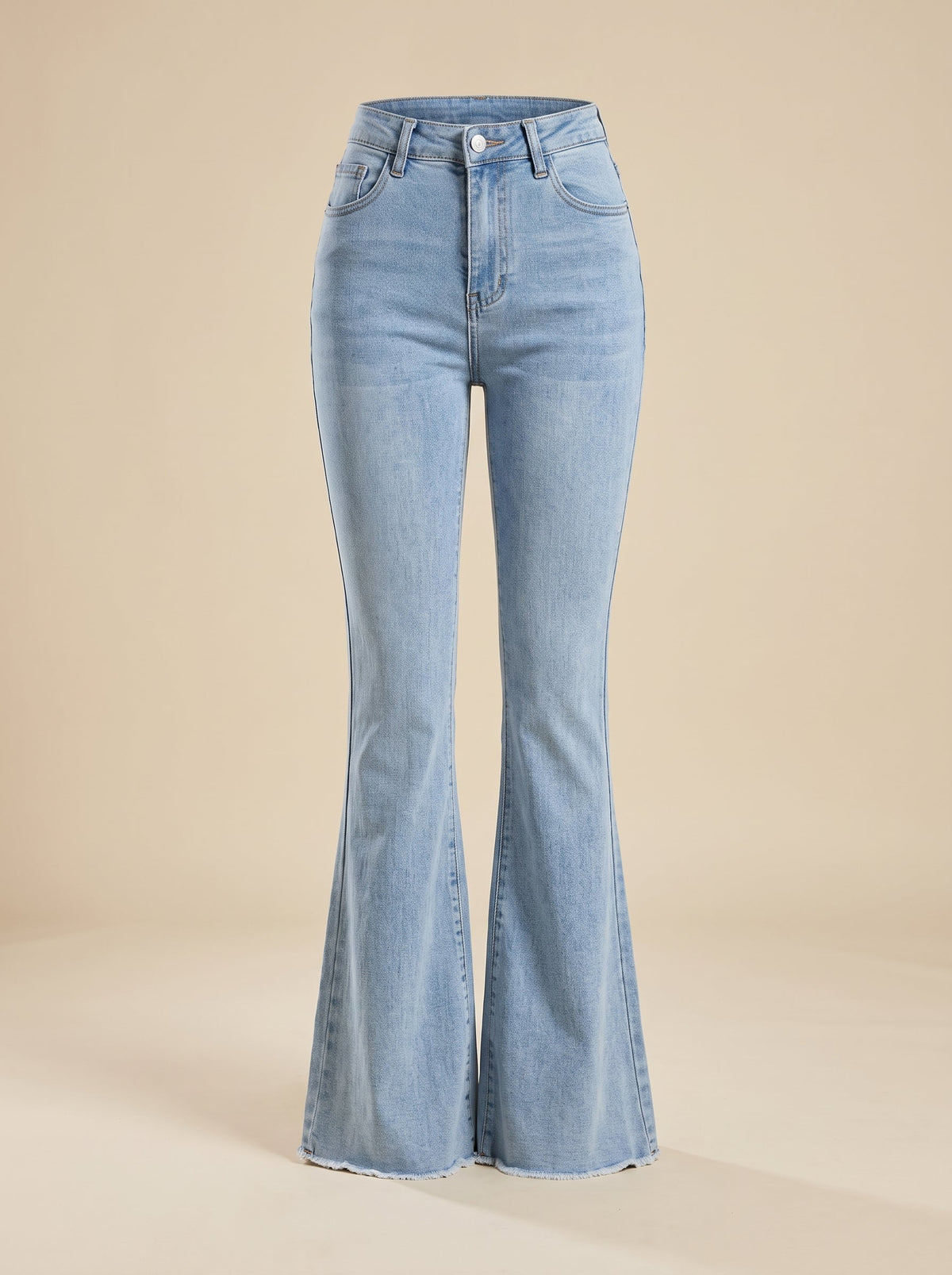 Flared denim jeans shown on a ghost mannequin in studio