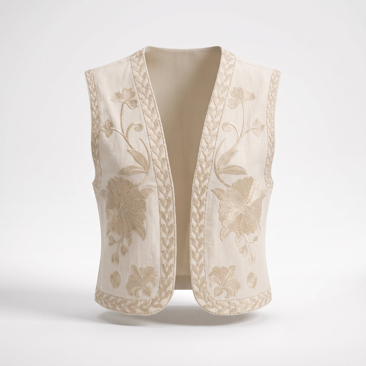 Beige embroidered boho vest shown on a ghost mannequin