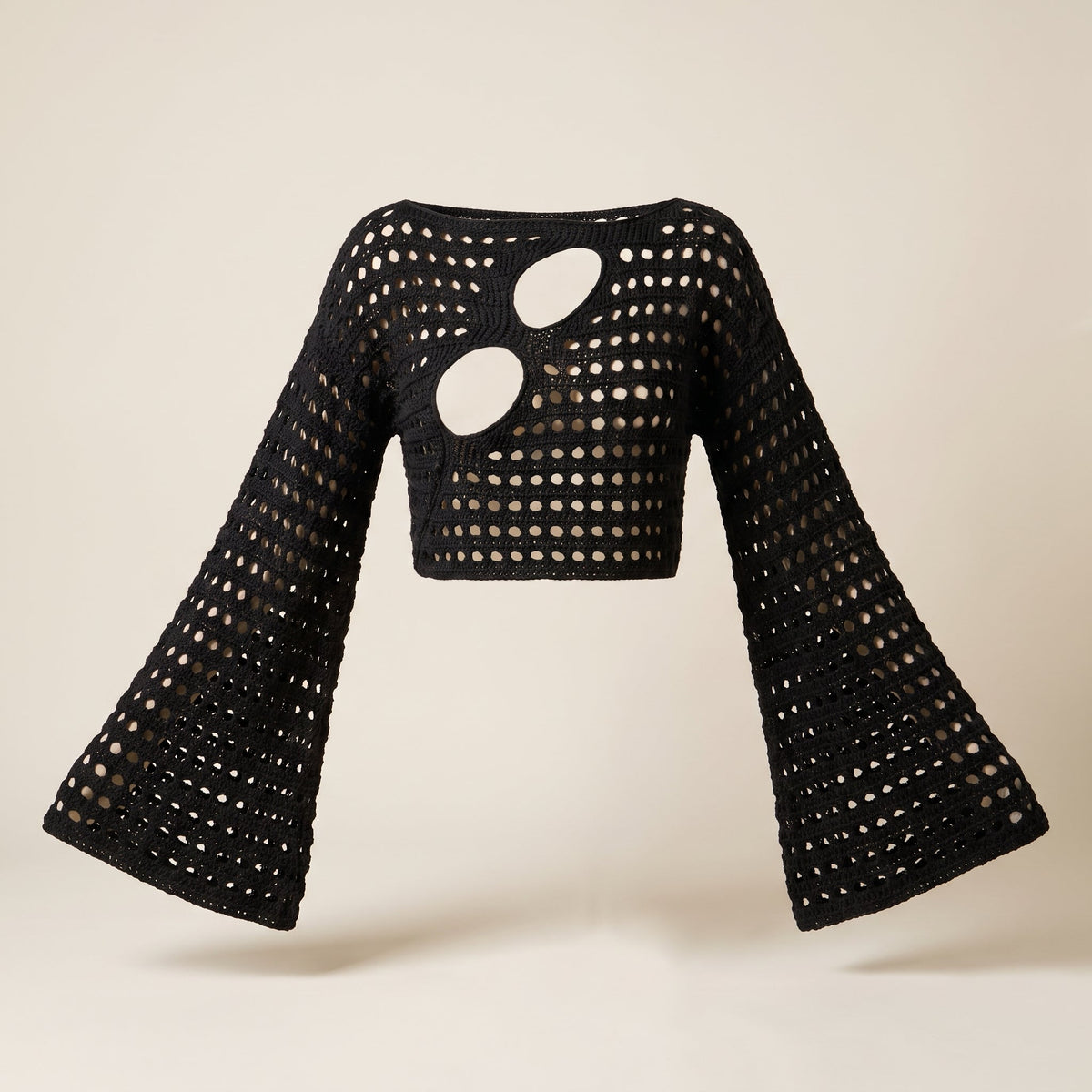 Black crochet top front view on ecru, flared long sleeves