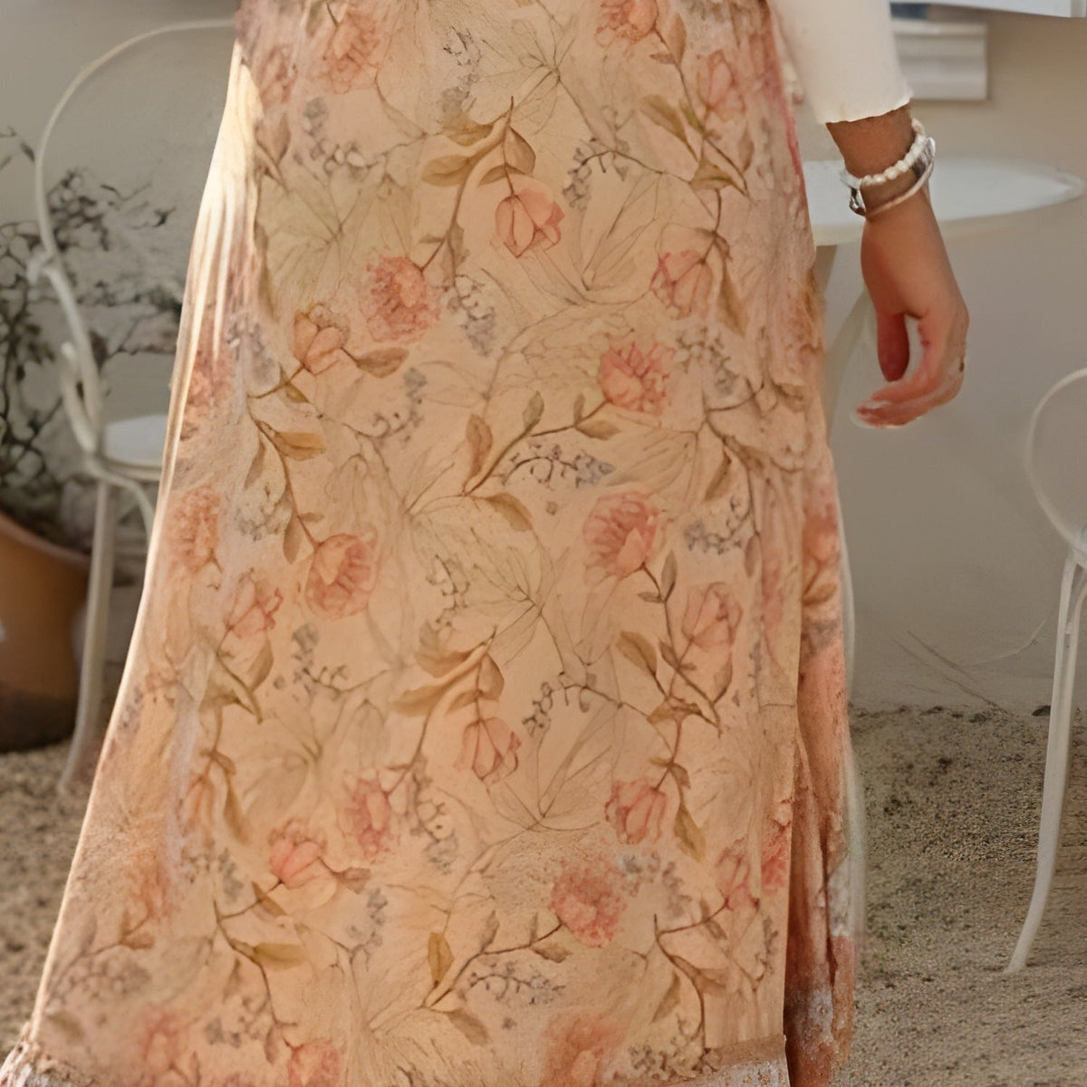 Close-up of the peach floral print and woven border