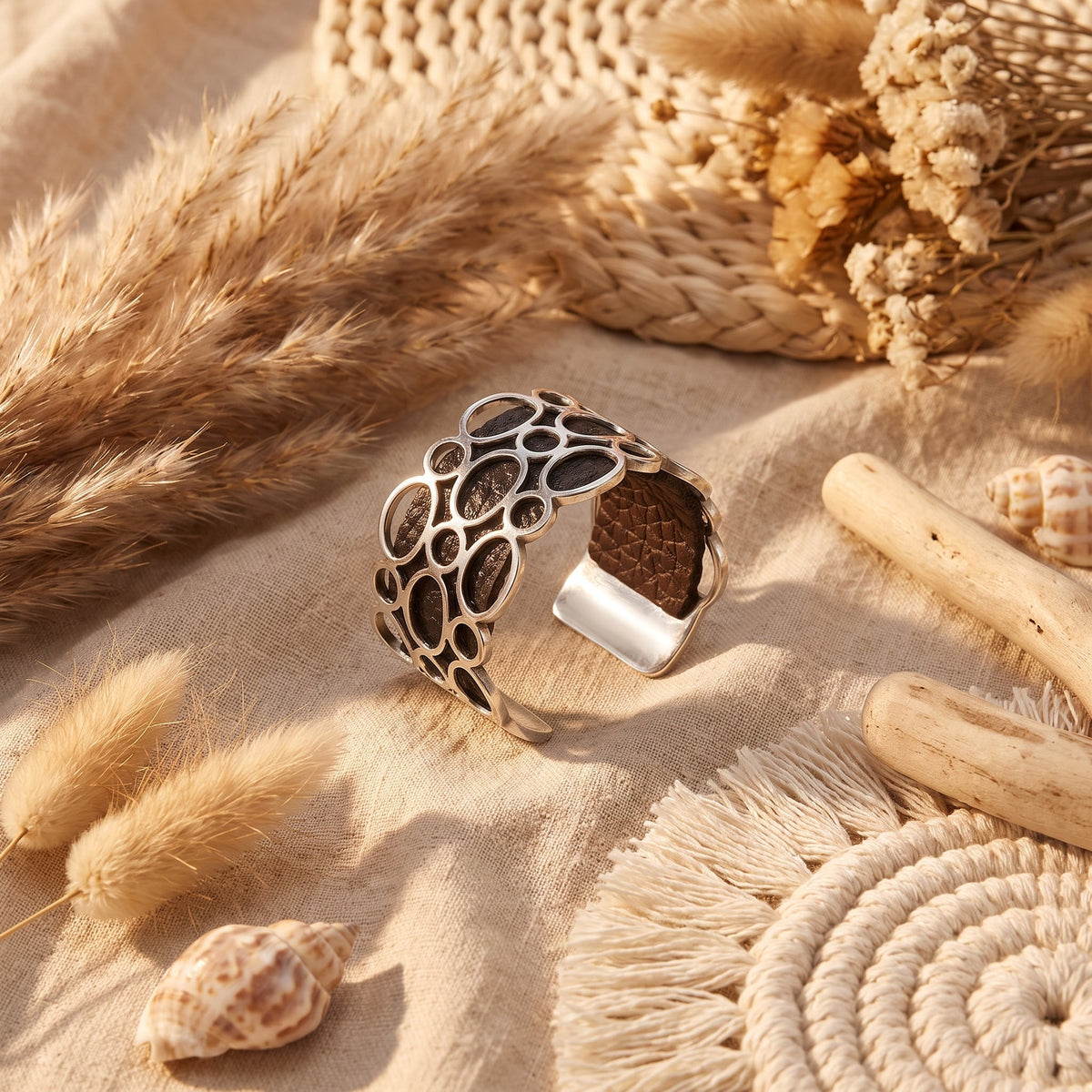 Silver cutout cuff bracelet styled in a boho setting