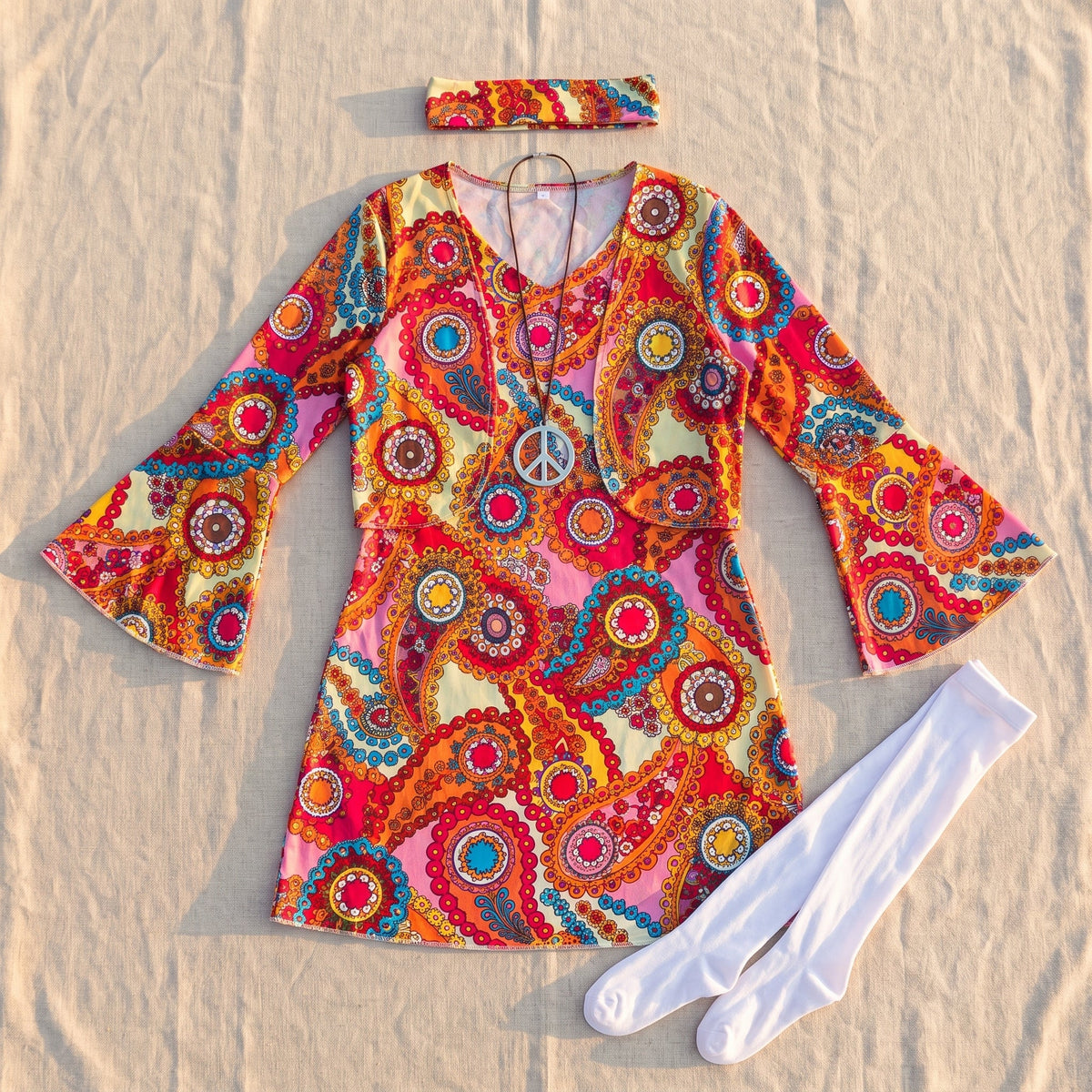 Short paisley dress with kimono sleeves in a festival setting
