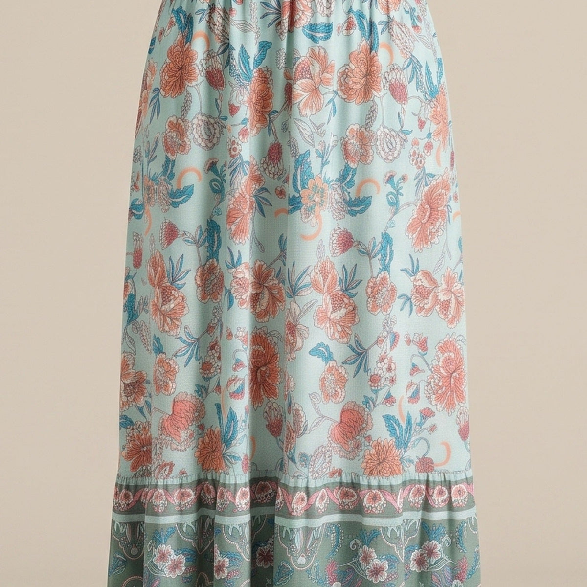 Close-up of the mint and coral boho floral print