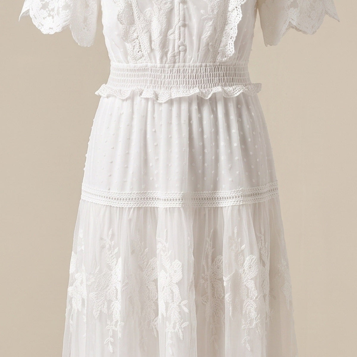 Close-up of floral lace and dotted swiss fabric