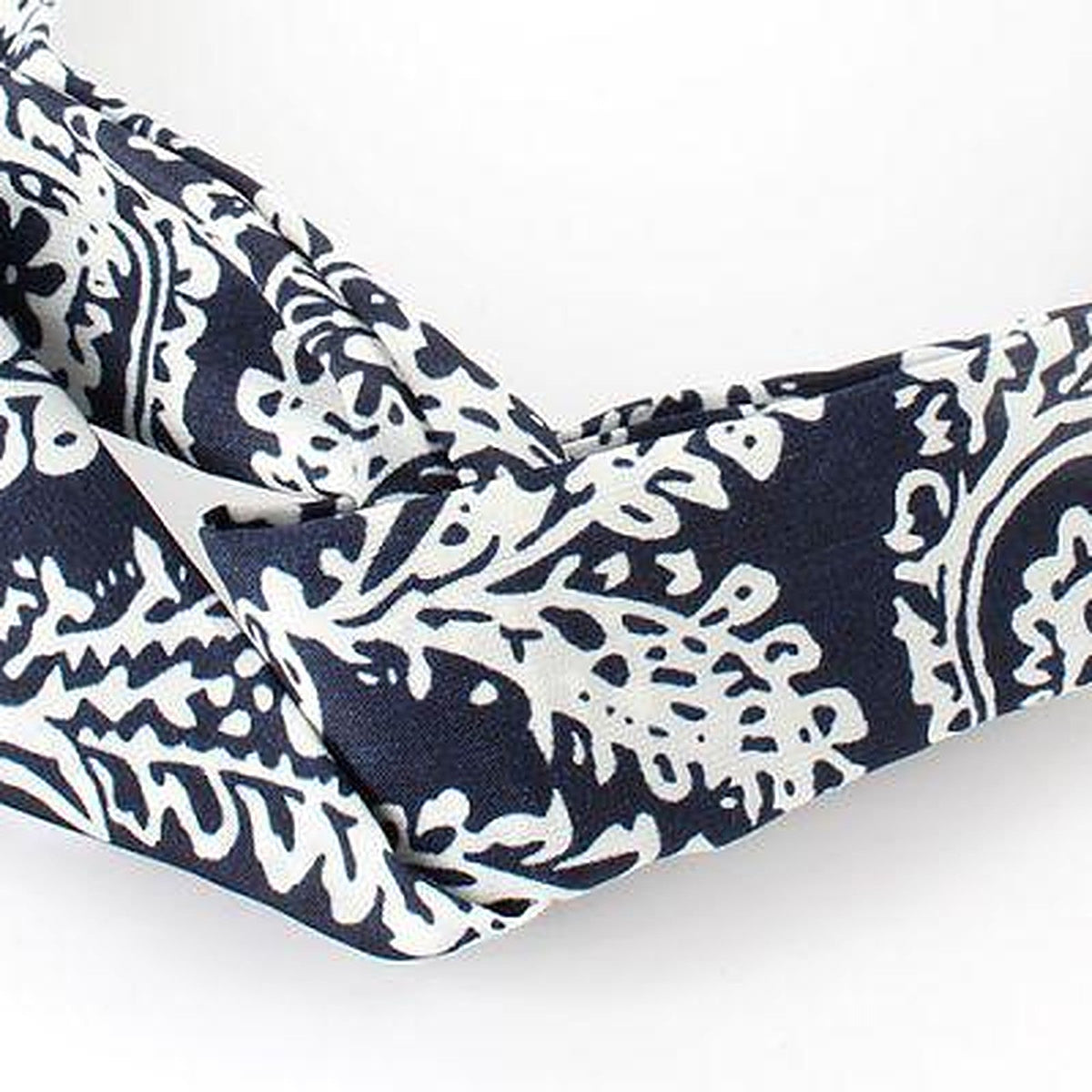Close-up of the twisted knot on the paisley headband