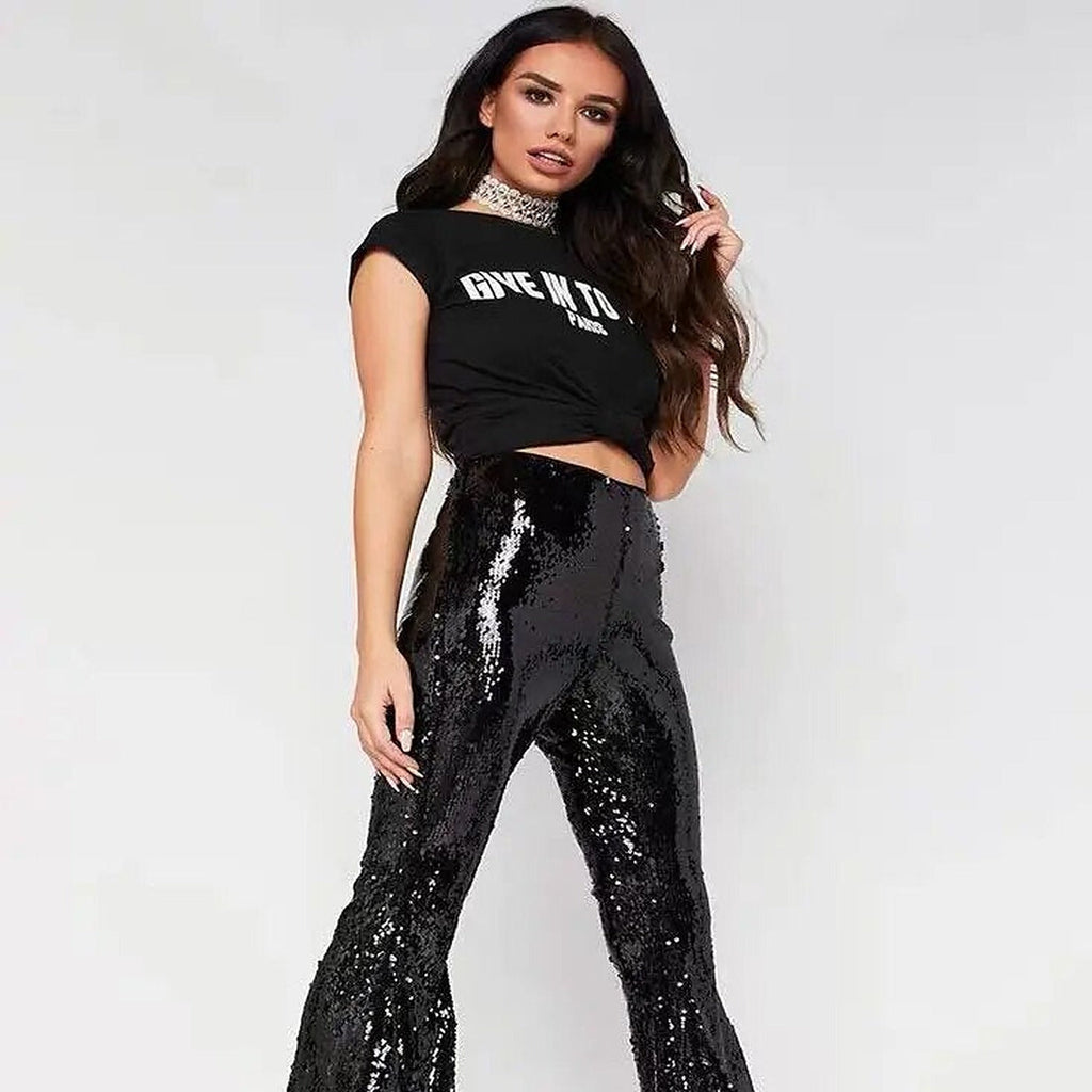 Sequin bell bottom pants styled in a boho setting