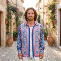 Smiling model wearing the pink and blue baroque satin hippie shirt