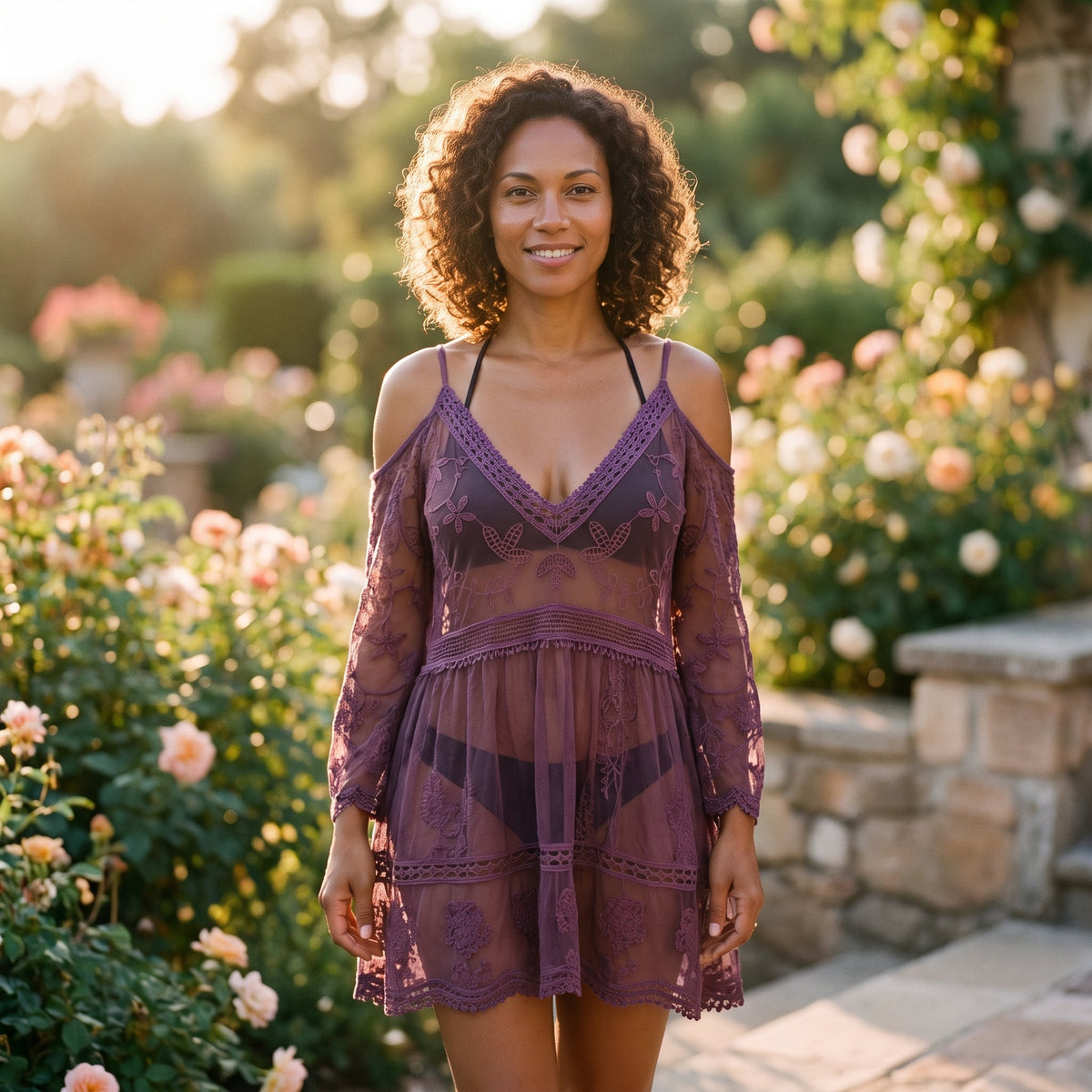 Plum purple lace beach tunic worn by a smiling model