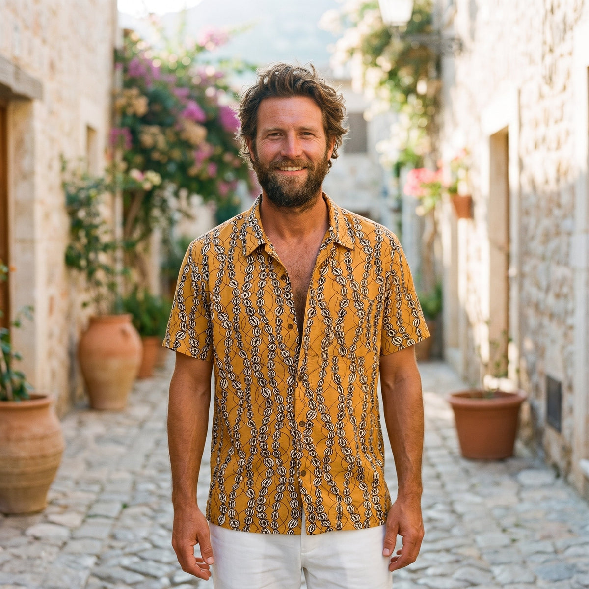 Smiling model wearing the vintage mustard men's hippie shirt outdoors