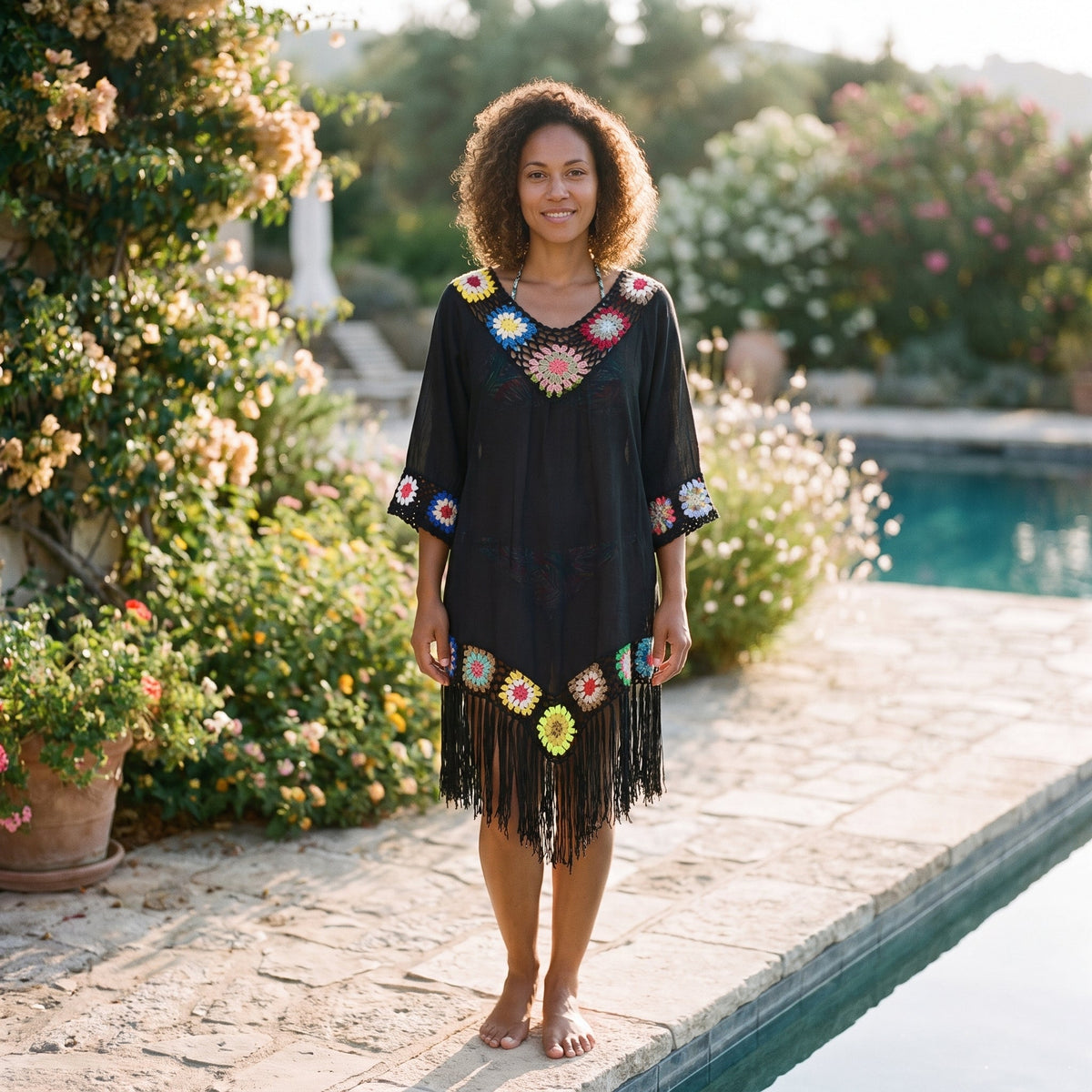 Black multicolor crochet beach tunic worn by a smiling model