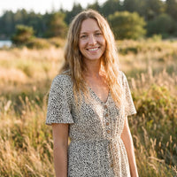 Smiling model wearing the speckled print hippie dress