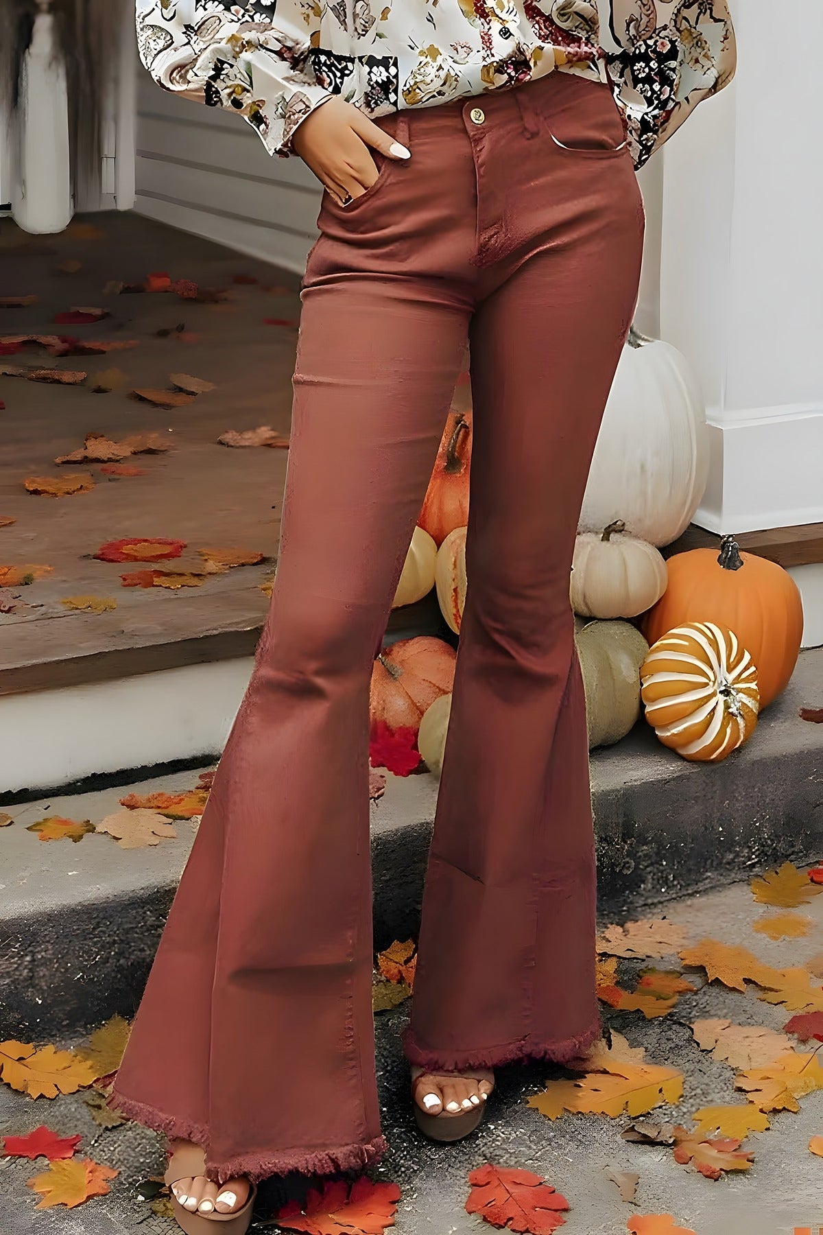 Brown denim flares fitted through the thigh and widening below