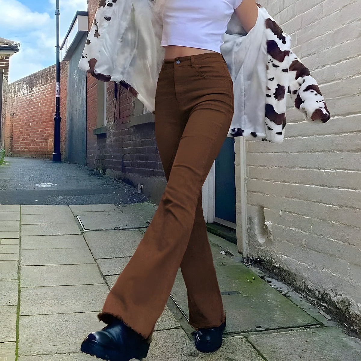 Flowy wide flared trousers shown from another angle
