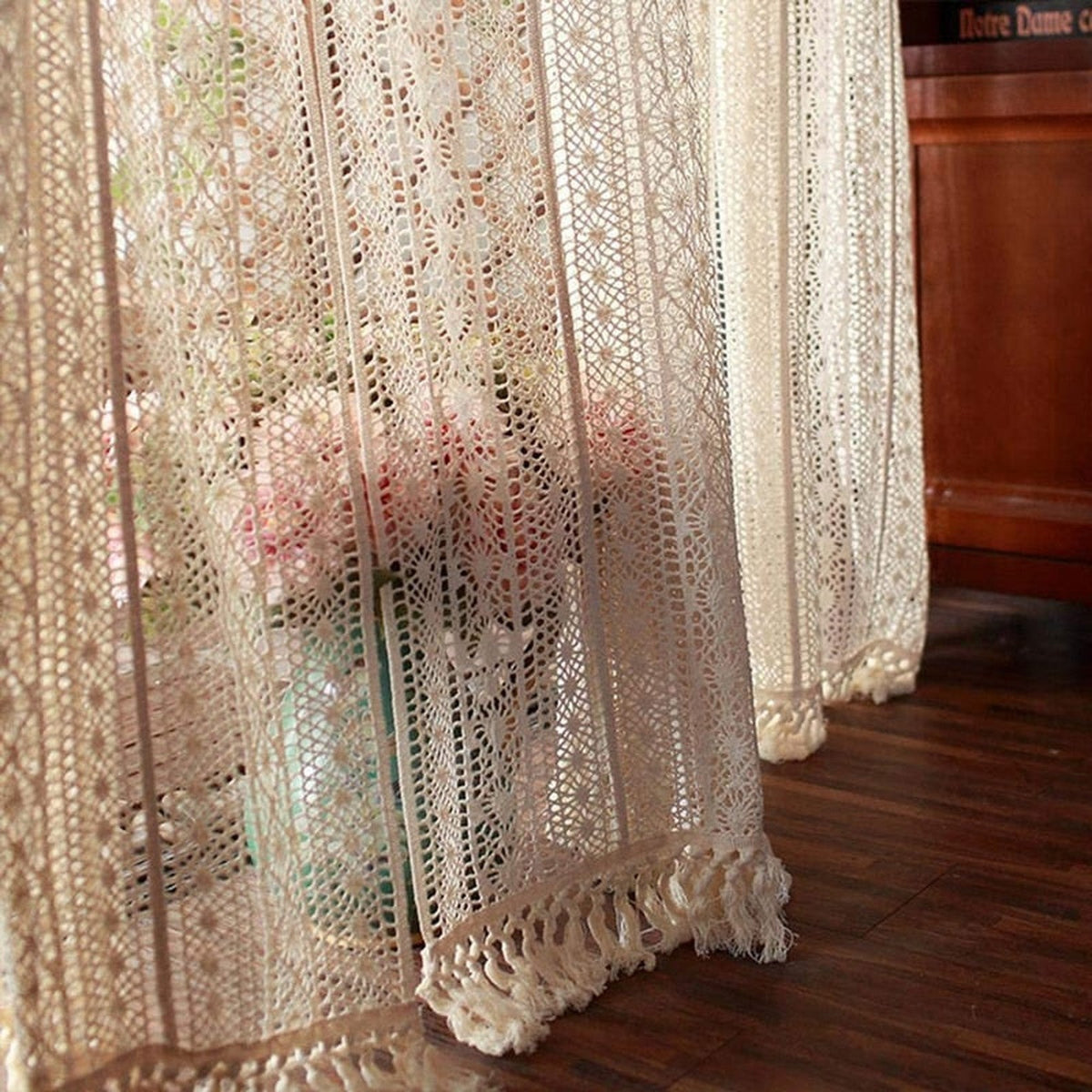 Close-up of the crochet lace openwork of the curtain